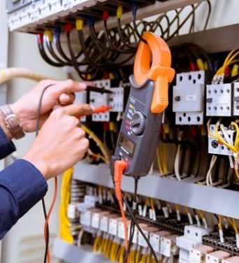 electrician-testing-electric-current-control-panel
