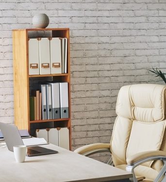 loft-style-office-with-laptop-sitting-desk-executive-chair-document-folders-shelves
