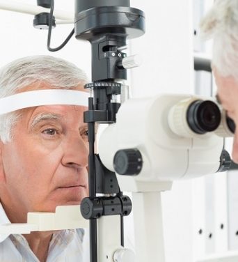 optometrist-doing-sight-testing-senior-patient