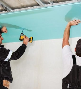 plasterboard-installers-men-assembling-drywall-false-ceiling-simple-affordable-renovation-premises